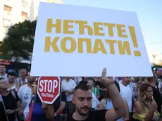 epa11543630 A protestor holds a sign reading 'You shall not mine' during a rally against plans to start mining lithium in Serbia, in Belgrade, Serbia, 10 August 2024. Plans to open lithium mines in Serbia were halted in 2021 after environmental groups started protesting against the proposed projects in different parts of Serbia but several wildlife preservation organizations and NGOs are warning that Rio Tinto and other mining companies have restarted their intentions for operations in the country. EPA/ANDREJ CUKIC