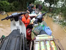 epa11596100 Local residents are evacuated on a boat at a flooded street in Hanoi, Vietnam, 10 September 2024. Typhoon Yagi, which struck northern Vietnam over the weekend, triggered severe flooding in Hanoi. The Red River's rapid rise inundated communities along the riverbank, forcing residents to seek refuge in safer areas. As of 09 September, the Vietnam Disaster and Dyke Management Authority reported at least 65 fatalities and 39 missing persons due to the typhoon. According to UNICEF, millions of families were affected by the widespread flooding and landslides caused by Yagi when it made landfall on 07 September. EPA/LUONG THAI LINH