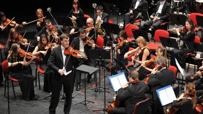 Udine 22 dicembre 2013.Teatro Nuovo Giovanni da Udine..Concerto di Natale con protesta per il mancato rinnovo dei contratti ai membri dell'orchestra..Copyright Foto Petrussi / Ferraro Simone