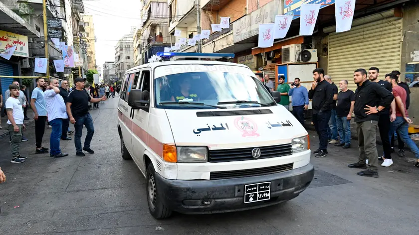 epaselect epa11611874 An ambulance drives in the southern suburb of Beirut after new blasts were reported, one day after exploding pagers killed 12, in Beirut, Lebanon, 18 September 2024. According to Lebanon’s state news agency, a number of wounded people were transferred to hospitals in the Beirut's southern suburbs following the explosion of wireless pagers on 18 September. Health Minister of Lebanon Firas Abiad said at least 12 people died and more than 2800 others injured after multiple wireless communication devices (pagers) were detonated on 17 September. Hezbollah declared in a statement that Israel was behind the strike and that there will be consequences. EPA/WAEL HAMZEH