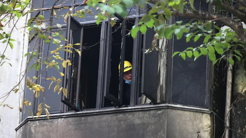 epa11078630 The aftermath of a house fire in Hanoi, Vietnam, 15 January 2024. Four people died in a fire which broke out in the early morning in their house at Hang Luoc street in Hanoi on 15 January. EPA/LUONG THAI LINH