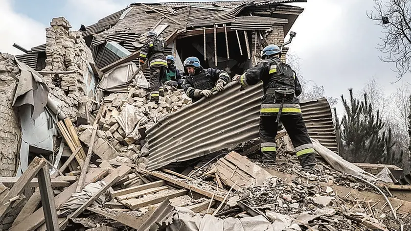 FILE - Ukrainian firefighters work at a damaged hospital maternity ward in Vilniansk, Zaporizhzhia region, Ukraine, Wednesday, Nov. 23, 2022. A Russian rocket struck the maternity wing of a hospital in eastern Ukraine on Wednesday, killing a newborn boy and critically injuring a doctor. (AP Photo/Kateryna Klochko, File)