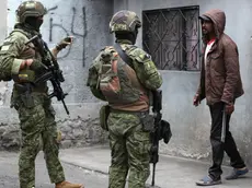 epa11070272 Ecuadorian soldiers talk to a man as they patrol in the People's Committee Zona Eleven neighborhood in Quito, Ecuador, 11 January 2024. Ecuadorian President Daniel Noboa declared on 09 January that government forces were engaged in an 'internal armed conflict' with armed criminal gangs, allowing him to use the army and not just the police to counter the violence, after riots began on 08 January in at least six prisons across the country. Guayaquil, Ecuador's largest city, was the hardest hit by the disturbances. At least 10 people were killed there on 09 January night, two of them police officers, and armed hooded men stormed a television station during a live broadcast. EPA/JOSE JACOME