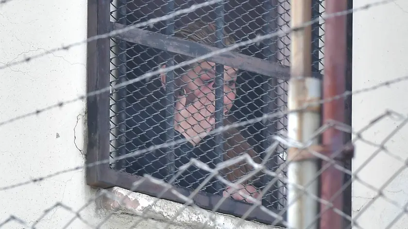 epa11235258 Former interim president Jeanine Anez looks out from her prison cell at Miraflores Women's Guidance Center in La Paz, Bolivia, 21 March 2024. The former interim president of Bolivia, Jeanine Anez (2019-2020), could not attend her mother's funeral, who died in Santa Cruz, due to bureaucratic obstacles that prevented her temporary release from the prison where she has been held since 2021 despite having a judicial permit. EPA/STRINGER