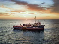 In this photo taken on Wednesday, Jan. 16, 2019 the Sea-Watch rescue ship sails through the Mediterranean Sea. A private rescue boat with dozens of migrants aboard sought permission for a second day to enter a safe port Sunday, but said so far its queries to several nations haven't succeeded. Another vessel crowded with panicking migrants and taking on water, meanwhile, put out an urgent, separate appeal for help in the southern Mediterranean. Sea-Watch 3, run by a German NGO, said Sunday it has contacted Italy, Malta, Libya as well as the Netherlands, since the boat is Dutch-flagged, asking where it can bring the 47 migrants it had taken aboard. Sea-Watch tweeted that Libyan officials had hung up when it asked for a port assignment. (Jon Stone/Sea-Watch via AP) [CopyrightNotice: Jon Stone/Sea-Watch.org]