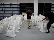 epa11318533 Members of the Panamanian Electoral Court organize bags with ballots in Panama City, Panama, 04 May 2024. Panama will hold general elections on 05 May. EPA/BIENVENIDO VELASCO