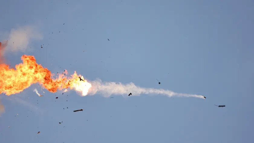 epa11563770 A Hezbollah unmanned aerial vehicle (UAV) crossing from Lebanon gets intercepted by an Israeli fighter jet over an area near the Lebanon-Israel border, as seen from northern Israel, 25 August 2024. The Israeli military stated that Israeli Air Force fighter jets are currently striking targets belonging to the Hezbollah organization that posed an imminent threat to the citizens of the State of Israel. EPA/ATEF SAFADI
