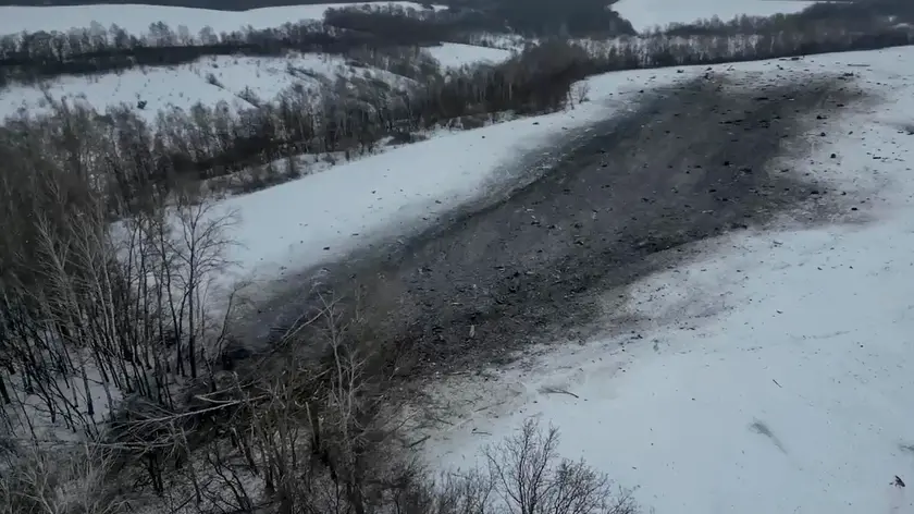 epa11104120 A still image taken from handout video provided by the Russian Investigative Committee shows the crash site of an Ilyushin Il-76 airlifter near the village of Yablonovo, Belgorod region, Russia, 25 January 2024. A flight parameters recording device and a voice recorder were found at the site, the Committee confirmed. The Il-76 plane crashed on 24 January while transporting Ukrainian prisoners of war who were being prepared for exchange. There were only 74 people on board, 65 of which were military personnel of the Armed Forces of Ukraine. The Russian Ministry of Defense reported that the plane was shot down by Ukrainian Armed Forces using an anti-aircraft missile system. The missile was launched from a position near the village of Liptsy, Kharkiv region. Radars of the Russian Aerospace Forces recorded the launch of two Ukrainian missiles, the ministry added. EPA/RUSSIAN INVESTIGATIVE COMMITEE HANDOUT HANDOUT EDITORIAL USE ONLY/NO SALES HANDOUT EDITORIAL USE ONLY/NO SALES HANDOUT EDITORIAL USE ONLY/NO SALES HANDOUT EDITORIAL USE ONLY/NO SALES