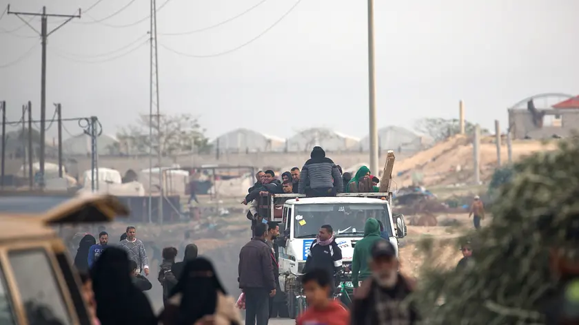 epa11045575 Displaced Palestinians from the Nuseirat, Bureij and parts of the Khan Yunis refugee camps, make their way to the city of Rafah after an Israeli warning of increasing military operations in the Gaza Strip camps, 27 December 2023. Since 07 October, up to 1.9 million people, or more than 85 percent of the population, have been displaced throughout the Gaza Strip, some more than once, according to the United Nations Relief and Works Agency for Palestine Refugees in the Near East (UNRWA), which added that most civilians in Gaza are in 'desperate need of humanitarian assistance and protection'. EPA/HAITHAM IMAD