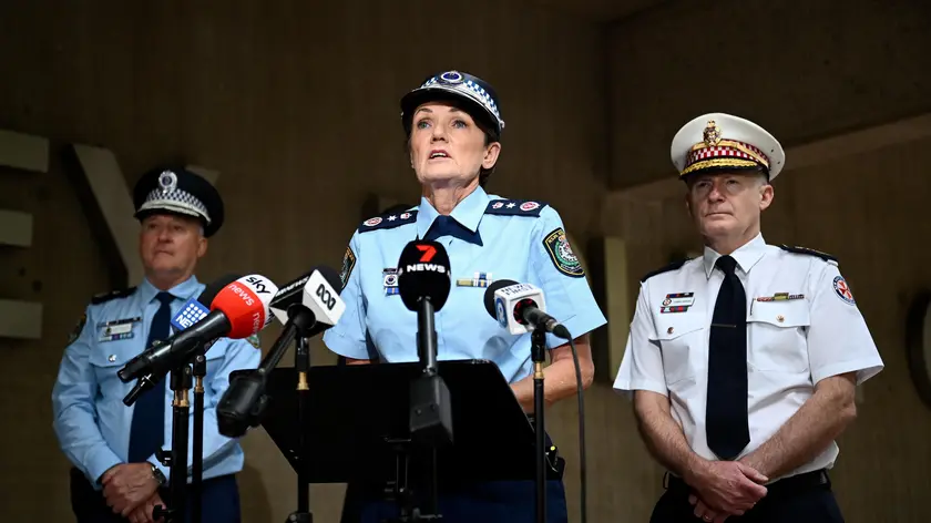 epa11281124 (L-R) NSW Police Deputy Commissioner Peter Thurtell, NSW Police Commissioner Karen Webb, and NSW Ambulance Commissioner Dr Dominic Morgan speak to the media during a press conference at Surry Hills Police Station, in Sydney, Australia, 16 April 2024. A 15-year-old boy has been arrested after a stabbing at an Orthodox Assyrian church in western Sydney which sparked unrest as an angry mob confronted police. EPA/BIANCA DE MARCHI AUSTRALIA AND NEW ZEALAND OUT