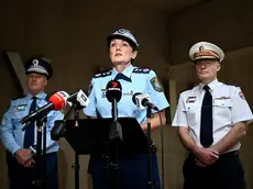 epa11281124 (L-R) NSW Police Deputy Commissioner Peter Thurtell, NSW Police Commissioner Karen Webb, and NSW Ambulance Commissioner Dr Dominic Morgan speak to the media during a press conference at Surry Hills Police Station, in Sydney, Australia, 16 April 2024. A 15-year-old boy has been arrested after a stabbing at an Orthodox Assyrian church in western Sydney which sparked unrest as an angry mob confronted police. EPA/BIANCA DE MARCHI AUSTRALIA AND NEW ZEALAND OUT