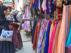 epa11265396 Kashmiri Muslim women check a dress as they shop ahead of the Eid al-Fitr holiday in Srinagar, the summer capital of Indian Kashmir, 08 April 2024. Eid al-Fitr is an Islamic holiday that marks the end of Ramadan, and is celebrated during the first three days of Shawwal, the 10th month of the Islamic calendar. It is expected to begin on 10 or 11 April 2024, depending on the lunar calendar. EPA/FAROOQ KHAN 49010
