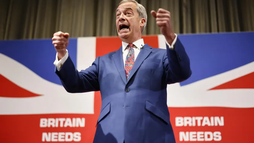 epaselect epa11379338 Honorary President of Reform UK Nigel Farage gestures while speaking at a press conference for the Reform UK party at the Glaziers Hall, London, Britain, 30 May 2024. Britain will hold a snap general election on 04 July 2024. EPA/TOLGA AKMEN