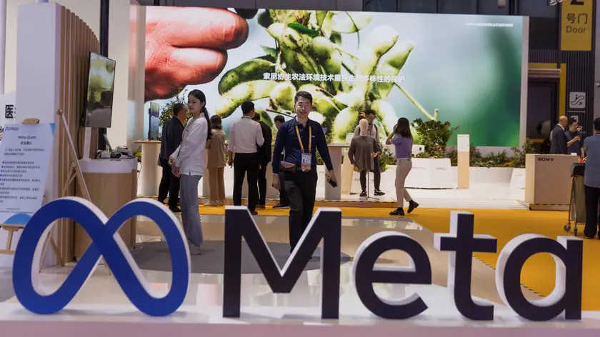epa10958954 A man walks at the Meta company booth at the China International Import Expo in Shanghai, China, 05 November 2023. The China International Import Expo (CIIE) in Shanghai runs from 05 to 10 November 2023. EPA/ALEX PLAVEVSKI