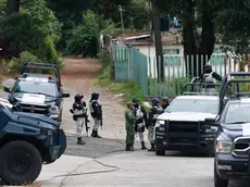 epa11023811 Members of the State Police patrol in the Texcapilla sector, in the town of Texcaltitlan, in the central State of Mexico, Mexico, 11 December 2023. The governor of the State of Mexico, Delfina Gomez, announced that they will maintain continuous surveillance and will install a National Guard base in the town of Texcapilla, where residents confronted members of the 'Familia Michoacana' cartel on 08 December, leaving 14 dead people, including 10 alleged criminals. EPA/Felipe Gutierrez