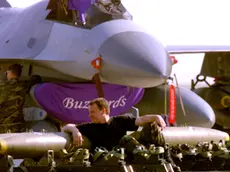 AVI01D:YUGOSLAVIA-KOSOVO-NATO:AVIANO,ITALY,1APR99 - U.S. soldier takes a rest over air bombs while an F16 is repaired behind him at Aviano air base in the North of Italy April 1. Aircrafts from the U.S., Canada, U.K., Spain and Portugal are at Aviano supporting NATO's Operation Allied Force. jr/Photo by Jose Manuel Ribeiro REUTERS