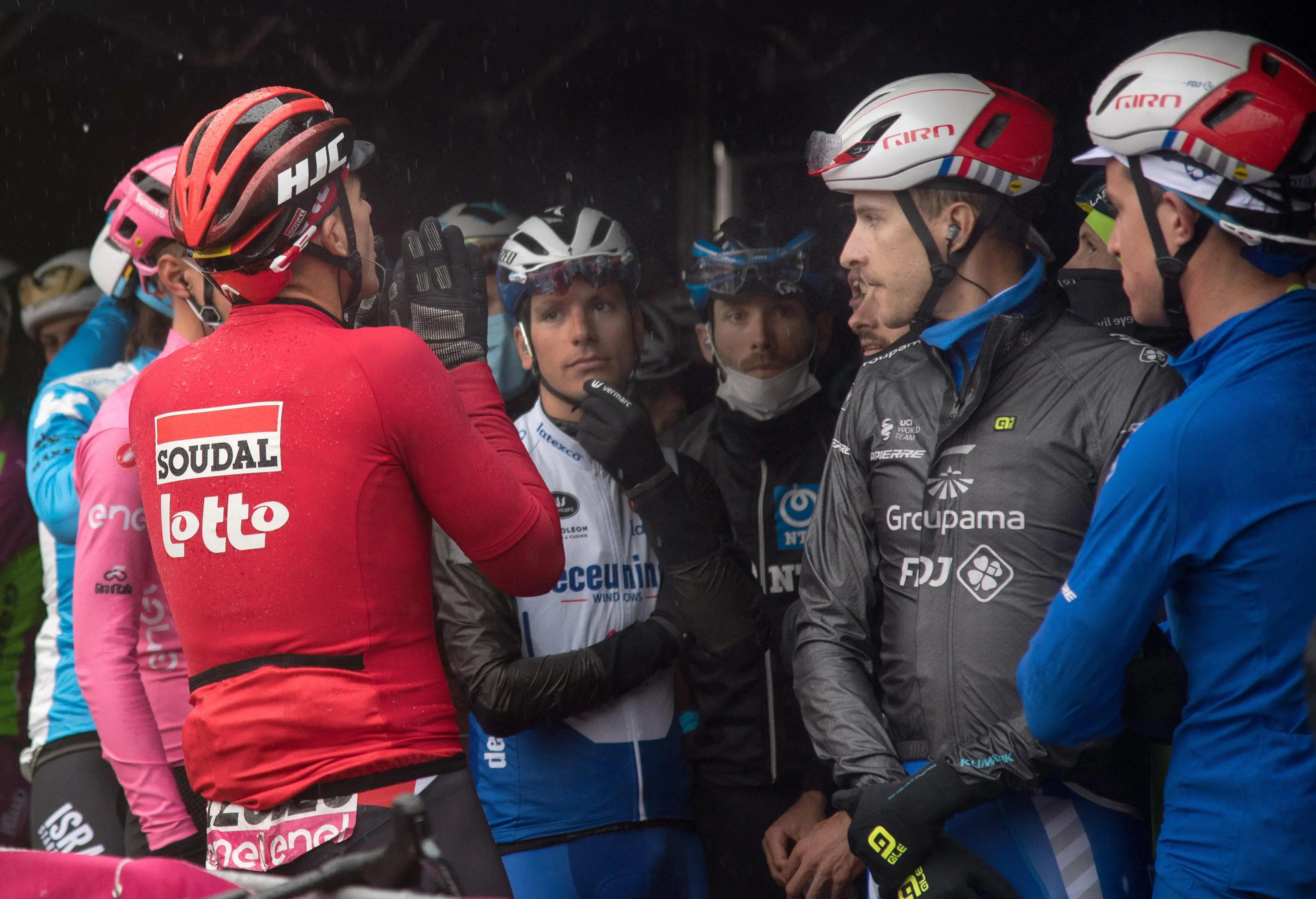 Autralian rider Adam Hanse of team Lotto-Soudal (C) spekes with Mauro Vegni, director of the Giro d'Italia, ahead the departure of the 19th stage of the 2020 Giro d'Italia cycling race over 258 km fromMorbegno to Asti, Italy, 23 October 2020. The unfavorable weather and pouring rain, in addition, led to the protest of the runners and led to a reduction of the route scheduled for the 19th stage, scheduled on a route around 120 km, from Abbiategrasso to Asti, The 103rd Giro d'Italia is scheduled from 3 to 25 October. ANSA//LUCA ZENNARO