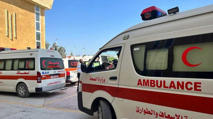 epa10956129 Ambulances cross the Rafah border crossing between the Gaza Strip and Egypt to bring injured people, in Rafah, Egypt, 03 November 2023. As per the agreement made by Egypt, Israel, and Hamas, a number of foreign nationals and individuals with critical injuries will be permitted to evacuate the besieged territory. More than 8,500 Palestinians and at least 1,400 Israelis have been killed, according to the Israel Defense Forces (IDF) and the Palestinian health authority, since Hamas militants launched an attack against Israel from the Gaza Strip on 07 October, and the Israeli operations in Gaza and the West Bank which followed it. EPA/STRINGER