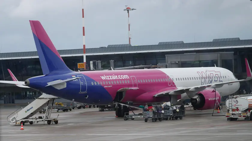 epa11455164 Wizz Air Airbus A321neo is seen at Riga Airport in Riga, Latvia, 03 July 2024. Riga Airport serves as a key Northern European air traffic hub, facilitating connections between the Baltic countries and major European business centers and popular holiday destinations. By joining the Net Zero 2050 initiative, Riga Airport has made a commitment to achieve climate neutrality by 2050. EPA/TOMS KALNINS