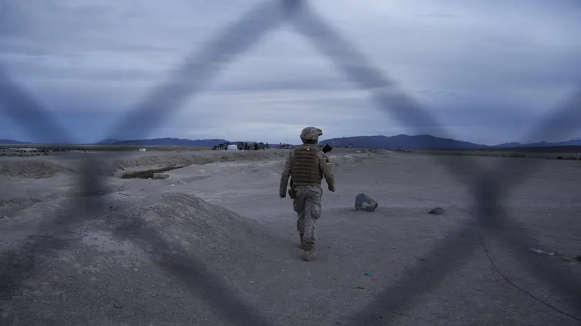epa09753936 Members of the Armed Forces stand guard in the Colchane, border commune with Bolivia and Chile, 13 February 2022. One day after the Chilean government imposed a 'state of emergency' in the northern border towns and the implementation of the new migration law, confusion and discontent erupted among the irregular migrants who arrived at the border crossings with Bolivia. EPA/Jose Caviedes