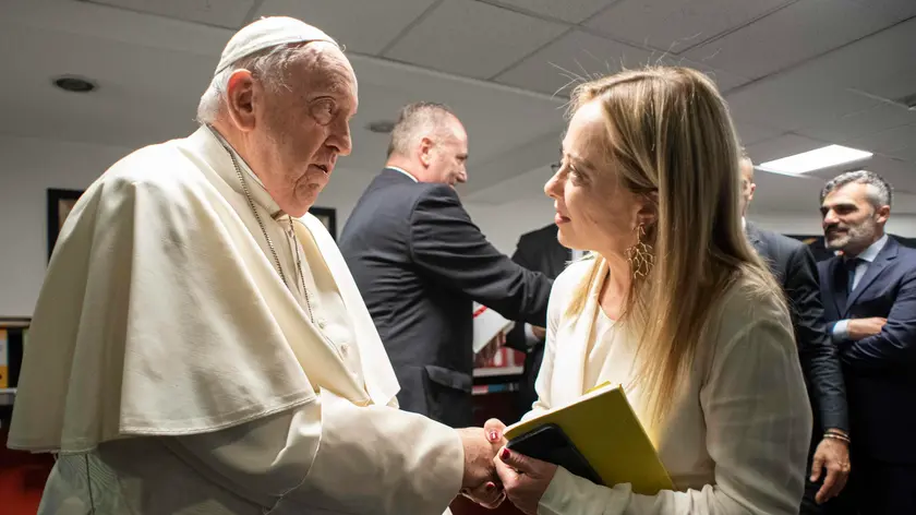 A handout picture provided by the Vatican Media shows Pope Francis and Italian Prime minister Giorgia Meloni at Conciliation auditorium during the event States General of the Natality, in Rome, Italy, 12 May 2023. ANSA/ VATICAN MEDIA +++ ANSA PROVIDES ACCESS TO THIS HANDOUT PHOTO TO BE USED SOLELY TO ILLUSTRATE NEWS REPORTING OR COMMENTARY ON THE FACTS OR EVENTS DEPICTED IN THIS IMAGE; NO ARCHIVING; NO LICENSING +++ NPK