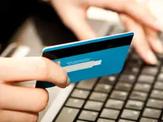 Online shopping with credit card on laptop