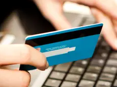Online shopping with credit card on laptop