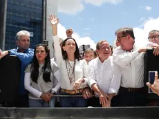 epa11569662 Venezuelan opposition leader Maria Corina Machado (C) greets supporters at a rally in Caracas, Venezuela, 28 August 2024. Machado said that 'not a single democratic government in the world has recognized' the re-election of Nicolas Maduro, whose victory in the July 28 presidential election she considers a 'fraud', as does a large part of the international community. EPA/RONALD PENA