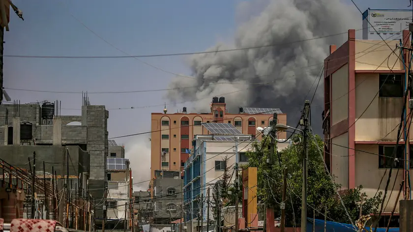 epa11397453 Smoke rises following an air strike during the Israeli military operation in Al Nusairat refugee camp in the central Gaza Strip 08 June 2024. More than 36,000 Palestinians and over 1,400 Israelis have been killed, according to the Palestinian Health Ministry and the Israel Defense Forces (IDF), since Hamas militants launched an attack against Israel from the Gaza Strip on 07 October 2023, and the Israeli operations in Gaza and the West Bank which followed it. EPA/MOHAMMED SABER