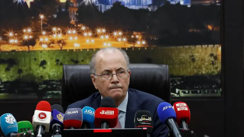 epa11255228 The new Prime Minister of the State of Palestine Mohammad Mustafa heads the first meeting of the new government, at the Palestinian government headquarter in the West Bank town of Ramallah, 02 April 2024. Palestinian President Mahmoud Abbas chose the 69-year-old business figure Mohammad Mustafa for the post of Prime Minister and asked him to form a government, after Mohammad Shtayyeh resigned as prime minister in February 2024. EPA/ALAA BADARNEH