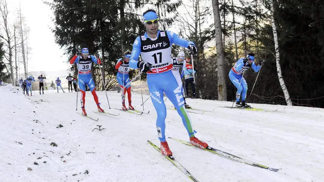 Italy's Giorgio Di Centa competes during the men's 15-kilometer Mass Start race at the cross country Tour de Ski competition, in Val di Fiemme, Italy, Saturday, Jan. 5, 2013. Di Centa finished in fourth place. (AP Photo/Elvis Piazzi)