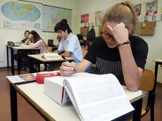 Gli studenti dell'istituto agrario "Serpieri" di Bologna impegnati nella prima prova scritta di italiano a Bologna, 20 giugno 2018. ANSA / GIORGIO BENVENUTI