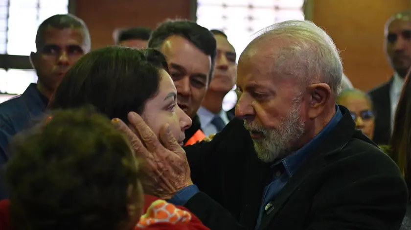 epaselect epa11342695 Brazilian President Luiz Inacio Lula Da Silva, with his wife Janja (R), meets people in a refugee site for those affected by the floodings in Sao Leopoldo, Rio Grande do Sul state, Brazil, 15 May 2024. The Government of the state of Rio Grande do Sul warned on 14 May that the Guaíba River could break the historical record reached last week, due to the heavy rains that fell in recent days. The worst floods in memory in the region have already caused more than 600,000 displaced people, 149 dead and 127 missing. EPA/Andre Borges