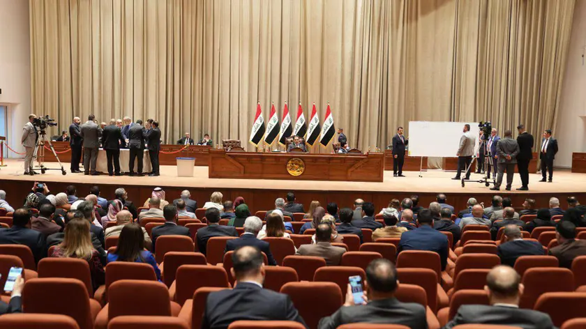 epa11351549 A handout photo made available by the Iraqi Parliament Media Office shows Members of Iraqi parliament attend a session to elect a new parliament speaker in Baghdad, Iraq, 18 May 2024. The Iraqi Parliament was unable to elect a new speaker in the second round of voting. The candidates, MPs Salem Al-Issawi and Mahmoud Al-Mashhadani, engaged in a close contest, with Al-Issawi receiving 158 votes and Al-Mashhadani 137 votes. The interim Parliament Presidency announced the postponement of the session until further notice, following a dispute between a number of Sunni representatives inside the meeting hall. EPA/IRAQI PARLIAMNET MEDIA OFFICE / HANDOUT HANDOUT EDITORIAL USE ONLY/NO SALES HANDOUT EDITORIAL USE ONLY/NO SALES