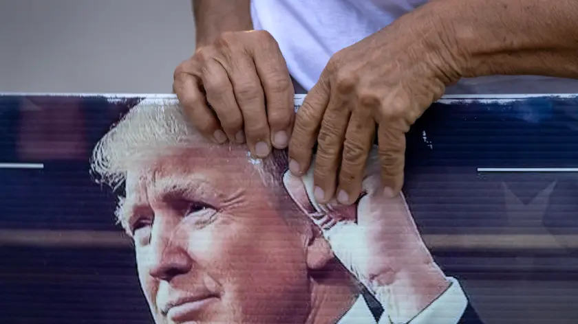 epa11380798 A former US President Donald Trump supporter stands in front of Trump’s Mar-a-Lago property after the guilty verdict in West Palm Beach, Florida, USA, 30 May 2024. Trump was found guilty on all 34 counts in his criminal trial in New York, after he faced 34 felony counts of falsifying business records related to payments made to adult film star Stormy Daniels during his 2016 presidential campaign. EPA/CRISTOBAL HERRERA-ULASHKEVICH