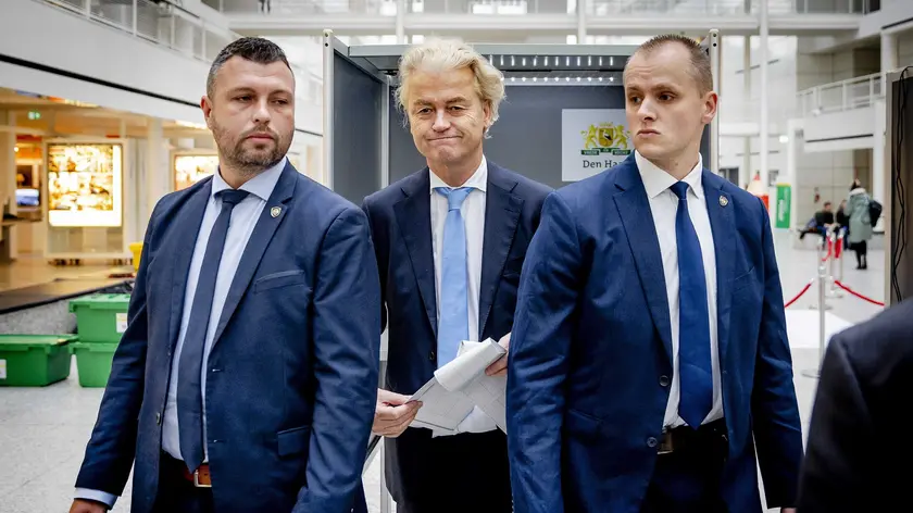 epa10988946 Party for Freedom (PVV) leader Geert Wilders (C) prepares to cast his vote in the House of Representatives elections at a polling station in The Hague, The Netherlands, 22 November 2023. Dutch voters are heading to the polls on 22 November to elect the members of the House of Representatives and a new prime minister, after Netherlands' longest-serving prime minister, Mark Rutte's cabinet collapsed in July. EPA/REMKO DE WAAL
