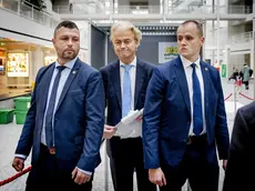 epa10988946 Party for Freedom (PVV) leader Geert Wilders (C) prepares to cast his vote in the House of Representatives elections at a polling station in The Hague, The Netherlands, 22 November 2023. Dutch voters are heading to the polls on 22 November to elect the members of the House of Representatives and a new prime minister, after Netherlands' longest-serving prime minister, Mark Rutte's cabinet collapsed in July. EPA/REMKO DE WAAL