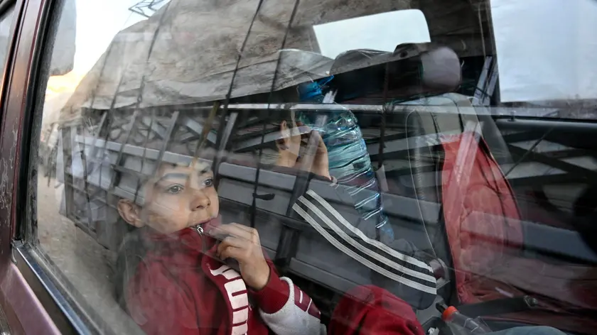 epa11338917 Syrian refugees sit inside a truck carrying their belongings as they prepare to leave the Arsal area, before their journey to their homes in Syria, at Arsal in Bekaa Valley, Lebanon, 14 May 2024. Lebanese state media said on 14 May, that some 330 Syrians in Lebanon began their 'voluntary' repatriation from different areas of Lebanon. The repatriation is being organization by Lebanon's General Directorate of the General Security. The most recent data from the UN Refugee Agency (UNHCR) indicates that there are approximately 1.5 million Syrian refugees have lived in Lebanon since the outbreak of the Syrian civil war more than ten years ago. Over the past five years, Lebanon, a country of around five million people, has experienced the worst economic catastrophe in its history. EPA/WAEL HAMZEH