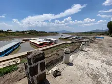 epa11353743 View of a pier at the Janitzio Lake in Michoacan state, Mexico, 19 May 2024. An atmospheric trend on the western side of Mexico is expected to trigger a heat wave with temperatures over 40 degrees Celsius. EPA/Alex Cruz