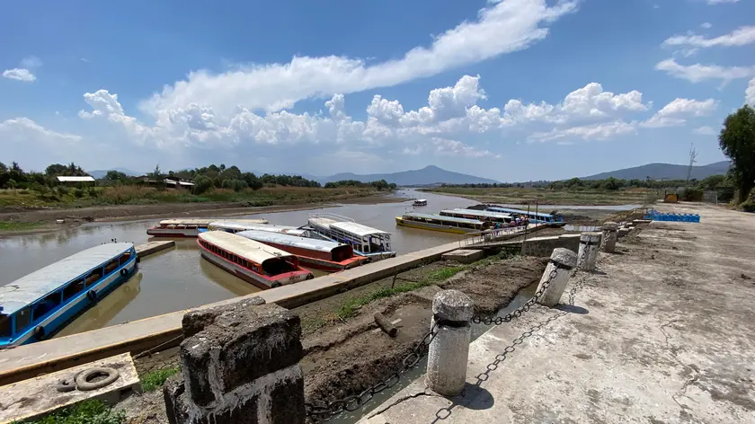 epa11353743 View of a pier at the Janitzio Lake in Michoacan state, Mexico, 19 May 2024. An atmospheric trend on the western side of Mexico is expected to trigger a heat wave with temperatures over 40 degrees Celsius. EPA/Alex Cruz