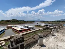 epa11353743 View of a pier at the Janitzio Lake in Michoacan state, Mexico, 19 May 2024. An atmospheric trend on the western side of Mexico is expected to trigger a heat wave with temperatures over 40 degrees Celsius. EPA/Alex Cruz
