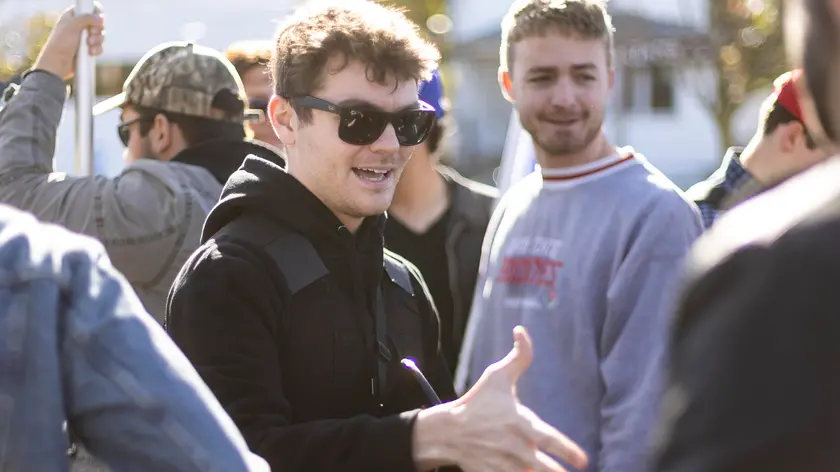 epa09574899 Far-right, white nationalist political commentator Nicholas J. Fuentes (C) greets supporters as he arrives for a protest against Covid-19 vaccines and government vaccination mandates outside of Staten Island University Hospital in the borough of Staten Island in New York, New York, USA, 10 November 2021. New York City has instituted vaccination mandates for all city employees and the CDC has approved vaccines for children five to twelve years-old, which has some people concerned that there will soon be a governmental mandate for children to be vaccinated to attended classes. The United States is facing pockets of resistance to the vaccine, and to mandates, despite widespread scientific evidence that it is safe for the vast majority of people and helps prevents serious Covid-19 related illness. EPA/JUSTIN LANE