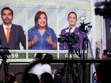 epa11354627 Journalists listen to the presidential debate in Mexico City, Mexico, 19 May 2024. The third and final debate of the three Mexican presidential candidates for the 02 June elections began with the participation of Claudia Sheinbaum from the ruling coalition Let's Keep Making History; Xochitl Galvez from the opposition alliance Strength and Heart for Mexico (Fuerza y Corazon por Mexico); and Jorge Alvarez Maynez, from the also opposition Citizen Movement. EPA/ISAAC ESQUIVEL