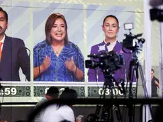 epa11354627 Journalists listen to the presidential debate in Mexico City, Mexico, 19 May 2024. The third and final debate of the three Mexican presidential candidates for the 02 June elections began with the participation of Claudia Sheinbaum from the ruling coalition Let's Keep Making History; Xochitl Galvez from the opposition alliance Strength and Heart for Mexico (Fuerza y Corazon por Mexico); and Jorge Alvarez Maynez, from the also opposition Citizen Movement. EPA/ISAAC ESQUIVEL