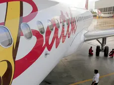 epa04498296 An Airbus A320 of Batik Airline, one of Lion Air Group member, stands in a hangar at Hang Nadim International Airport in Batam, Riau, Indonesia, 21 November 2014. Lion Group in March 2014 ordered a total 234 aircrafts from Airbus's A320 family. EPA/BAGUS INDAHONO