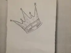 La copertina del manuale di iniziazione sequetrato a sette giovani riconducibili ai Latin king, una delle gang storiche di giovani sudamericani, 24 marzo 2014. I giovani sono stati fermati in un giardino pubblico a Milano. ANSA/SALVATORE GARZILLO