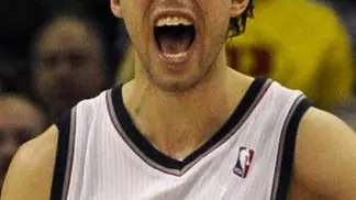 New Jersey Nets Sasha Vujacic celebrates after their win over the Toronto Raptors after their NBA basketball match at the O2 Arena in London, Saturday, March 5, 2011. (AP Photo/Tom Hevezi)