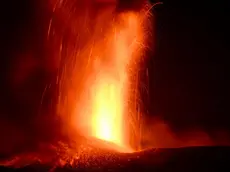 epa11480946 The Mount Etna volcano spews lava during an eruption in Sicily island, Italy, 15 July 2024 (issued 16 July 2024). Mount Etna's Voragine crater spewed lava through the night, with a column of ash that reached an altitude of about 6,000 meters above sea level. EPA/ORIETTA SCARDINO