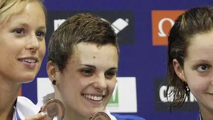 Italy's Erika Ferraioli, Frederica Pellegrini, Erica Buratto and Alice Mizzau, from left, display the bronze medal they won in the Women's 4x100 meter Freestyle final at the European Swimming Championships in Debrecen, Hungary, Monday, May 21, 2012. (AP Photo/ Michael Sohn)