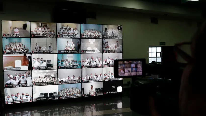 epa11137804 Monitors shows gang members during a simultaneous virtual hearing in different prisons at the Isidro Menendez judicial center, in San Salvador, El Salvador, 08 February 2024. A court in El Salvador held one of the first virtual hearings against 492 leaders of the Mara Salvatrucha (MS13) gang, including historical leaders, for more than 37,000 crimes, in the midst of the 'war against gangs' of the Salvadoran Government. EPA/RODRIGO SURA